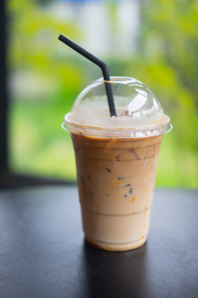 istock Ice caramel mochiato in takeaway cup on black table 1029758692