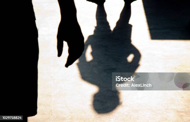 Blurry Shadow Silhouette Of Two Boys Confronting Each Other Stock Photo - Download Image Now