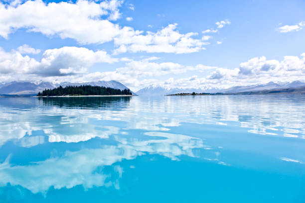 istock Reflections of clouds on the flat surface of Lake Tekapo 1029765140
