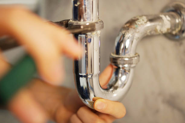 istock Closeup of plumber fixing pipe with wrench 1029765446