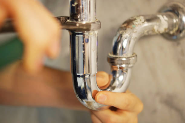 istock Closeup of plumber fixing pipe with wrench 1029765474