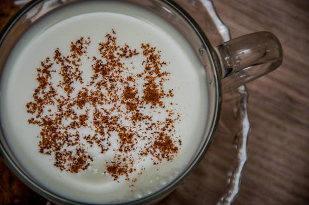 istock Milk and cinnamon on wood backround 1029765682