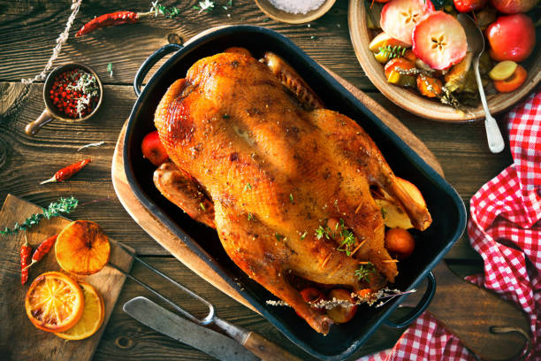 Roast Christmas duck with thyme and apples