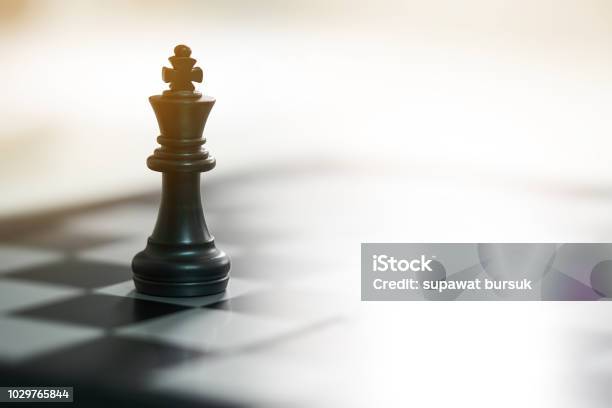 Chessboard With A Chess Piece On The Back Negotiating In Business As Background Business Concept And Strategy Concept With Copy Space Stock Photo - Download Image Now