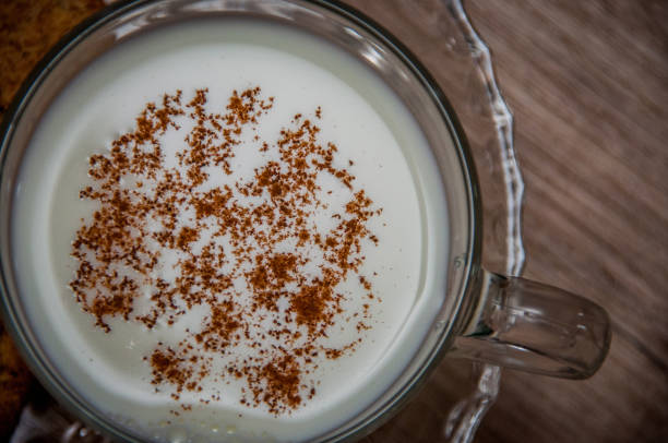 istock Milk and cinnamon on wood backround 1029767964
