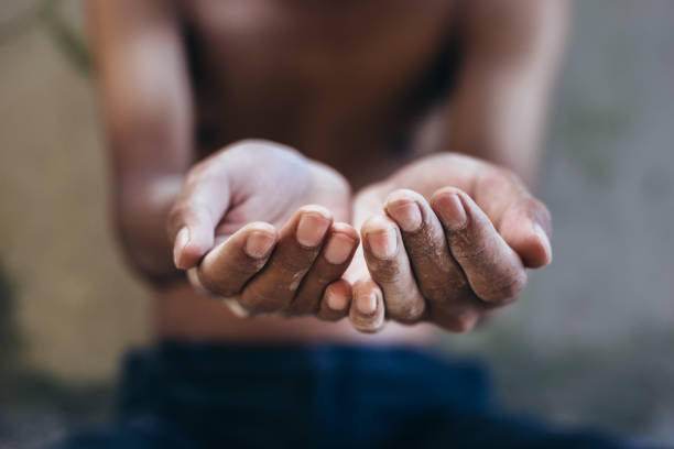 istock hands of hunger child 1029775110