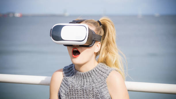 istock Woman wearing VR outside 1029780416