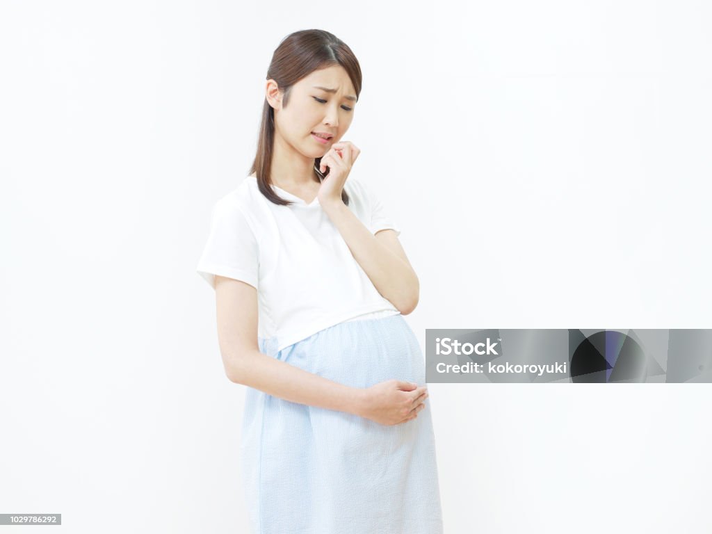 concerned Asian woman Pregnant Stock Photo