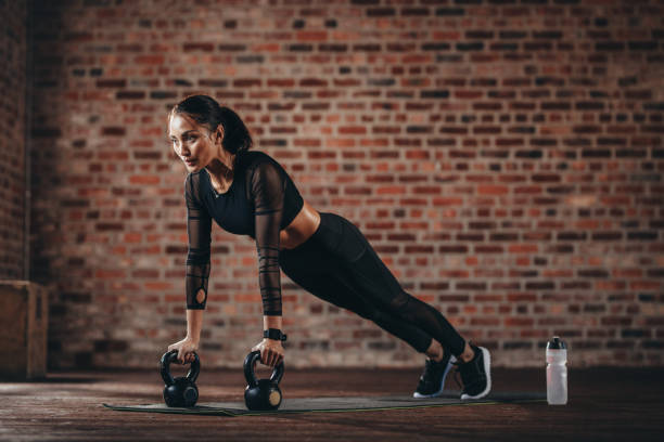 istock Woman working out at cross training gym 1029786858