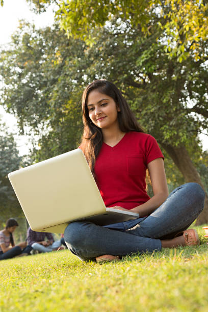 istock Young female student in the park - Stock image 1029791516