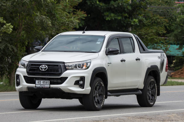 Private Pickup Truck Car New Toyota Hilux Revo  Rocco Chiangmai, Thailand - August  3 2018: Private Pickup Truck Car New Toyota Hilux Revo  Rocco. On road no.1001, 8 km from Chiangmai city. toyota hilux stock pictures, royalty-free photos & images