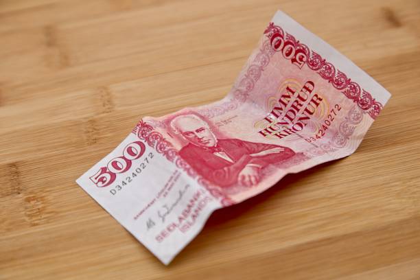 istock 500 Icelandic Kroner on a wooden table top. 1029814728