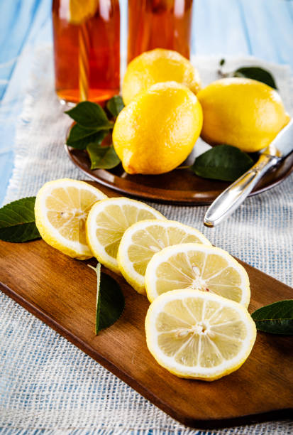istock Lemon slices with lemonade on wooden table 1029814738