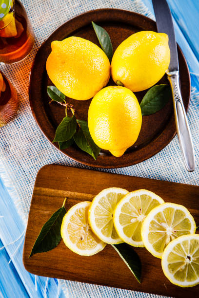 istock Lemon slices with lemonade on wooden table 1029814926