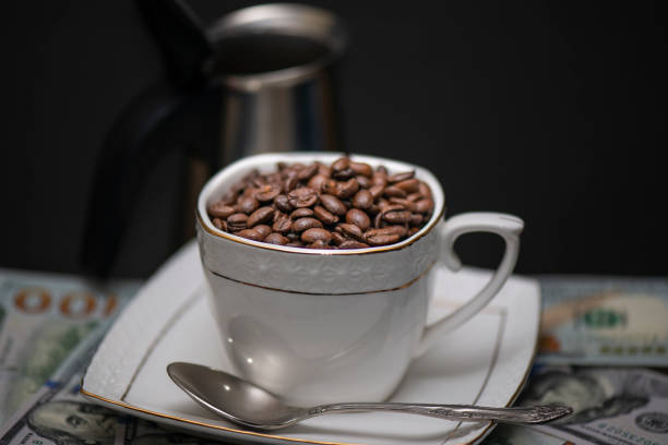 istock Coffee beans in Cup on black background 1029822126