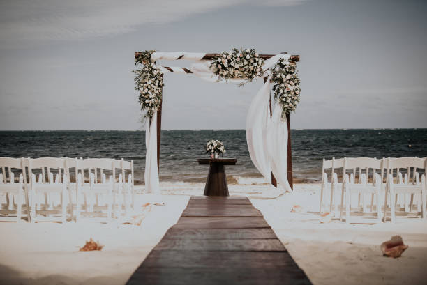 Wedding setting on a Caribbean beach. Vacation related images and travel themes in the Caribbean. Image taken at Morrocoy National Park, Venezuela. Morrocoy is a coastline and a group of small islands and cays located at Falcon State in Venezuela. A very popular destination for leisure, diving, kite surfing and all kind of water activities. Morrocoy and the beauty of the turquoise coastal beaches of Venezuela are almost indistinguishable from those of the Bahamas, French Polynesia, Malau, Hawaii, Cancun, Costa Rica, Florida, Maldives, Cuba, Fiji, Bora Bora,  Puerto Rico, Honduras, or other tropical vacation travel destinations