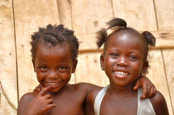istock Close-Up Portrait Of Smiling Siblings 1029830540
