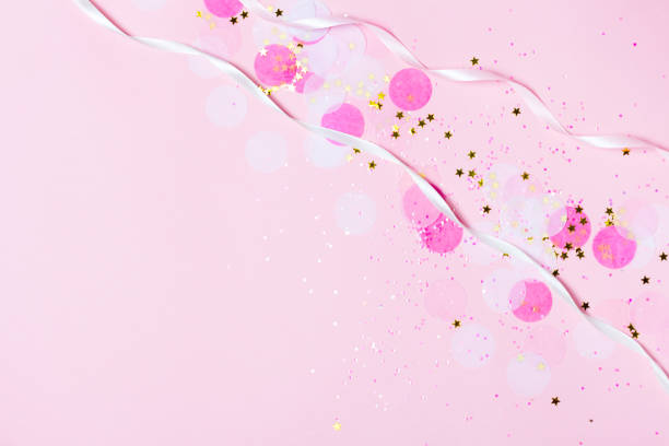 istock Pink confetti and stars and sparkles on pink background. 1029837968