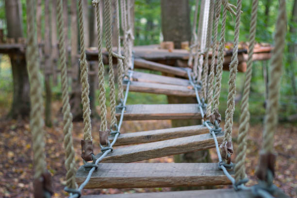Rope bridge at adventure climbing park with natural background