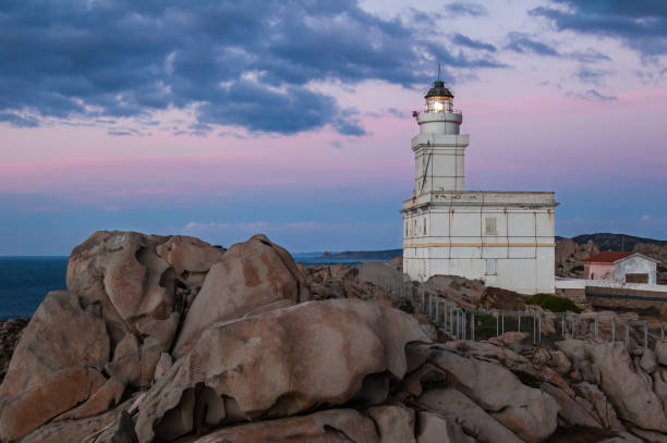 istock Lighthouse of Capo Testa at sunset (Italy) 1029854642