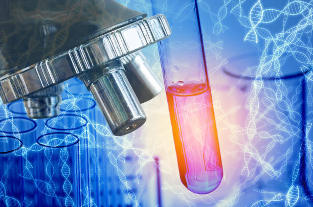 istock Digital Composite Image Of Microscope And Test Tube Over Dna Stands 1029855656