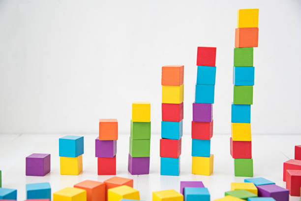 istock Close-Up Of Multi Colored Toy Blocks Stacked On Table 1029855800
