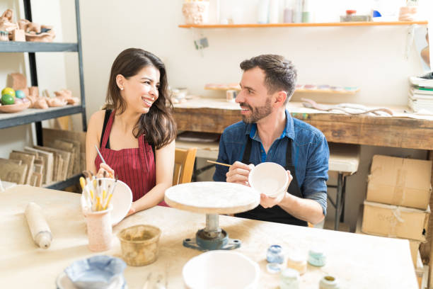 istock Couple Having Fun During Pottery Date In Workshop 1029860626
