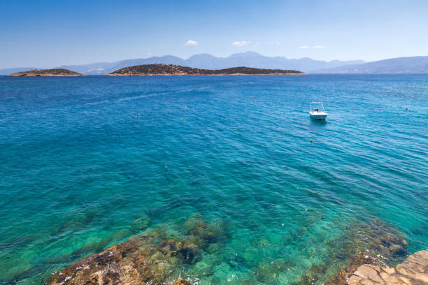 Small motorboat at clear water bay of Loutro town on Crete island, Greece