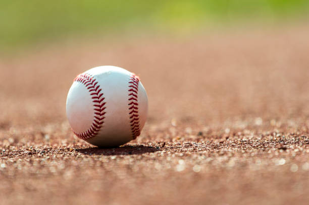 istock new baseball ball on red track rubber 1029864786