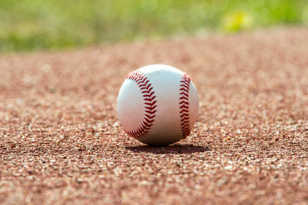 istock new baseball ball on red track rubber 1029864810