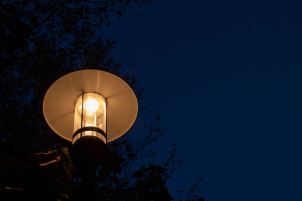 istock Modern led street lamp against dark blue sky. 1029869278