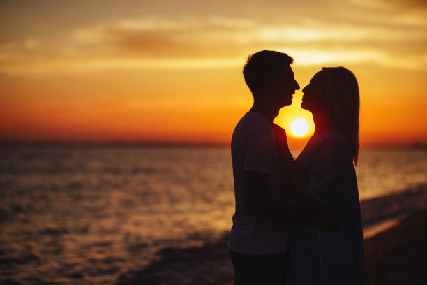 istock Young happy couple on seashore. 1029879886