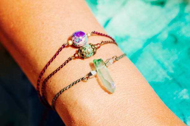 istock Female hand wearing natural stone bead bracelets 1029888864