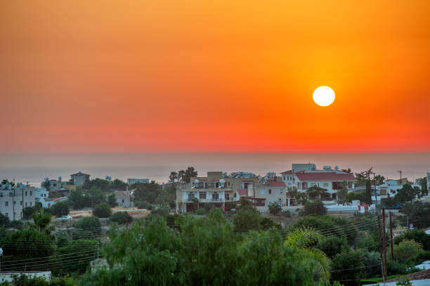 istock Sunset over cyprus village on sea coast 1029889080