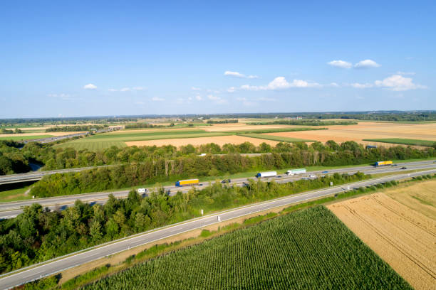 istock Aerial view of highway with trucks 1029892644