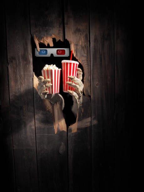 istock Zombie hand through hole cracked in rustic wood.Halloween theme 1029892732