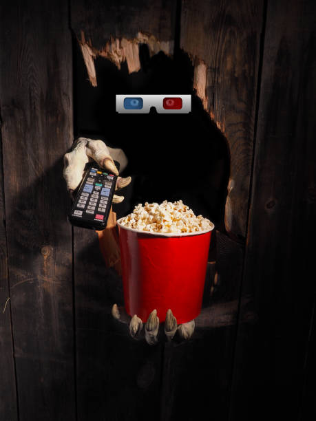 istock Zombie hand through hole cracked in rustic wood.Halloween theme 1029892746