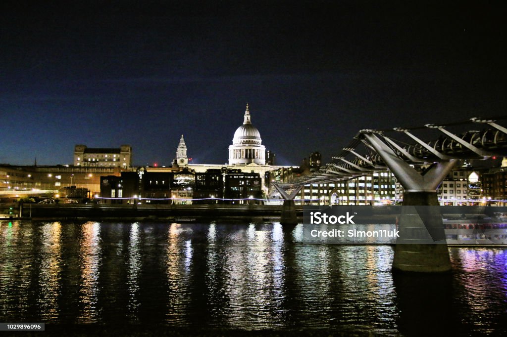 A view of St Pauls Cathedral across the river Thames at night Architecture Stock Photo