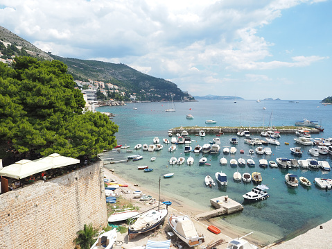 Panoramic view of Dubrovnik old town, its marina port and Lokrum island