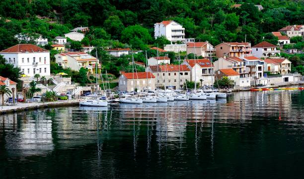 istock Village reflections in Kotor Bay 1029899540