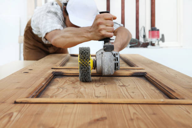 istock carpenter work the wood with the sander grinding electric tools for rustic wooden effects 1029899900
