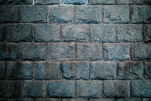 dark blue stone wall