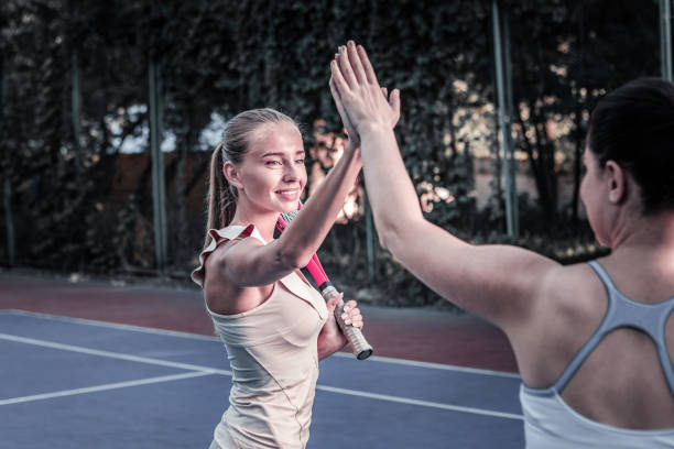 istock Energetic two women contesting in tennis match 1029912666