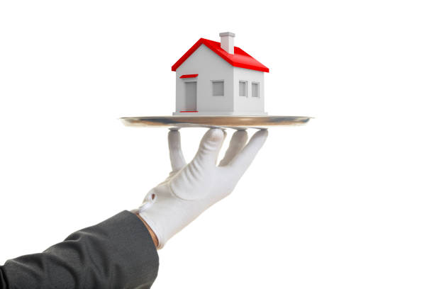 istock 3d rendering waiter offering a house 1029918692