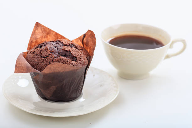 istock Cup of coffee and chocolate muffin 1029942830