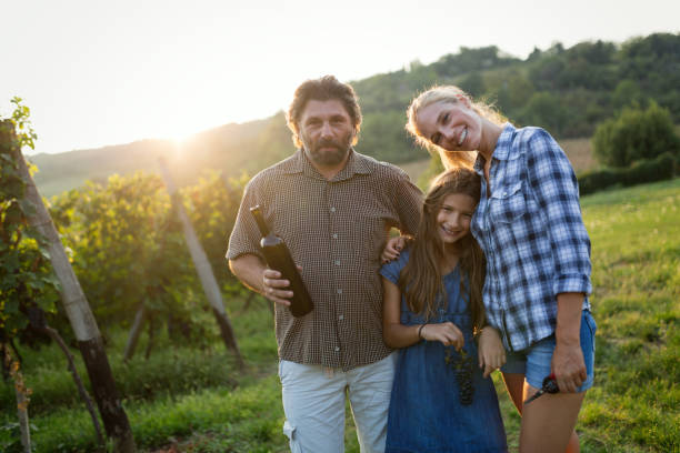 istock Wine grower and people in vineyard 1029942994