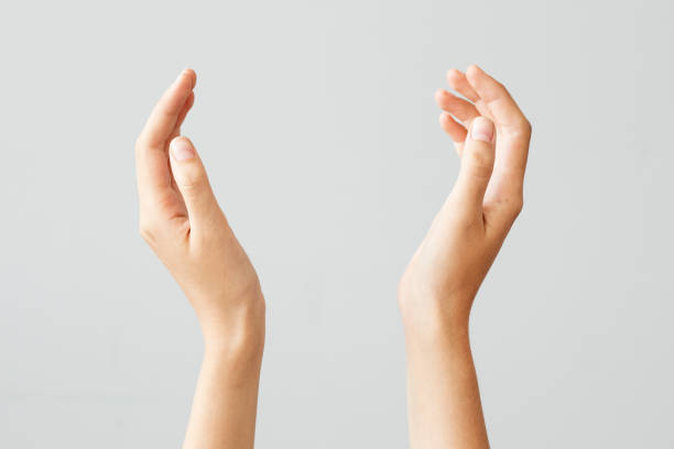 Female hand holding something on isolated background