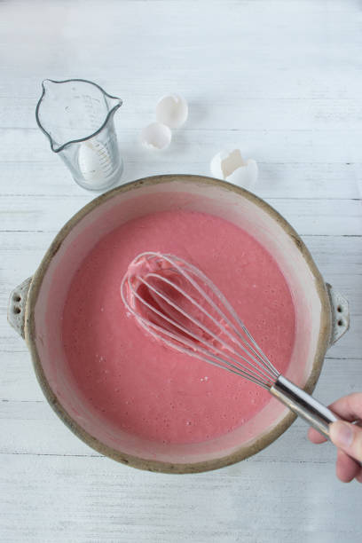 mix torta rosa in ciotola con uova vista dall'alto - cake batter foto e immagini stock