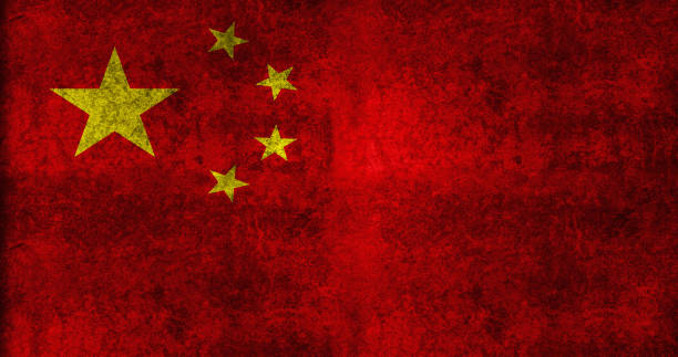Chinese Flag on cracked wall background.