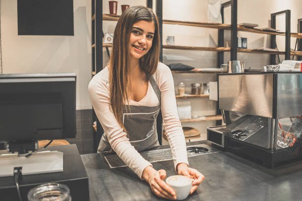 istock The cafe worker holding a cup of coffee 1029955770